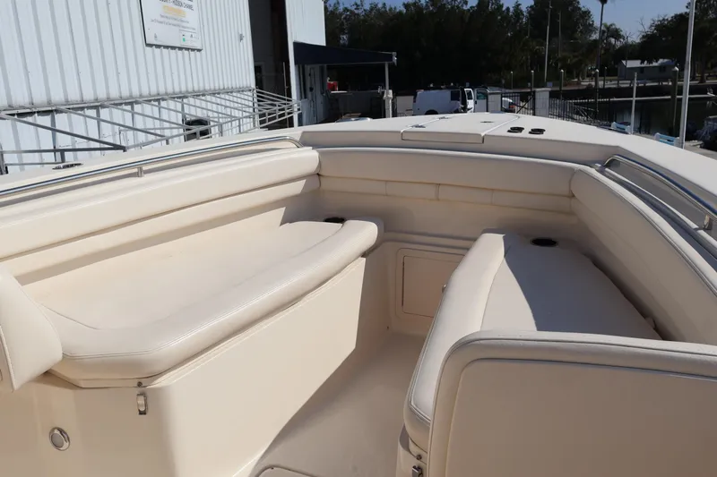  Yacht Photos Pics 2017 Grady-White Canyon 306 boat interior with cushioned seating and storage compartments.