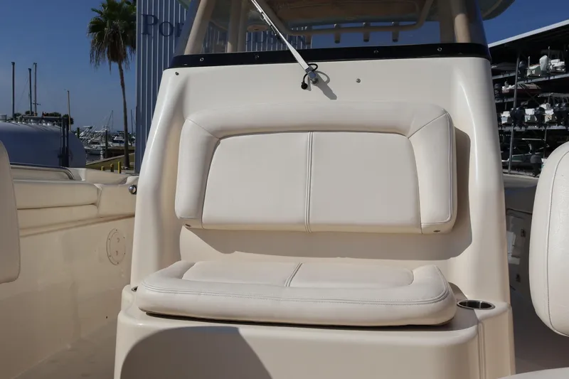  Yacht Photos Pics 2017 Grady-White Canyon 306 boat seat, beige upholstery, marina background.