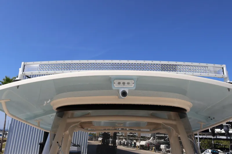 Yacht Photos Pics 2017 Grady-White Canyon 306 boat with LED light bar and camera, under clear blue sky.