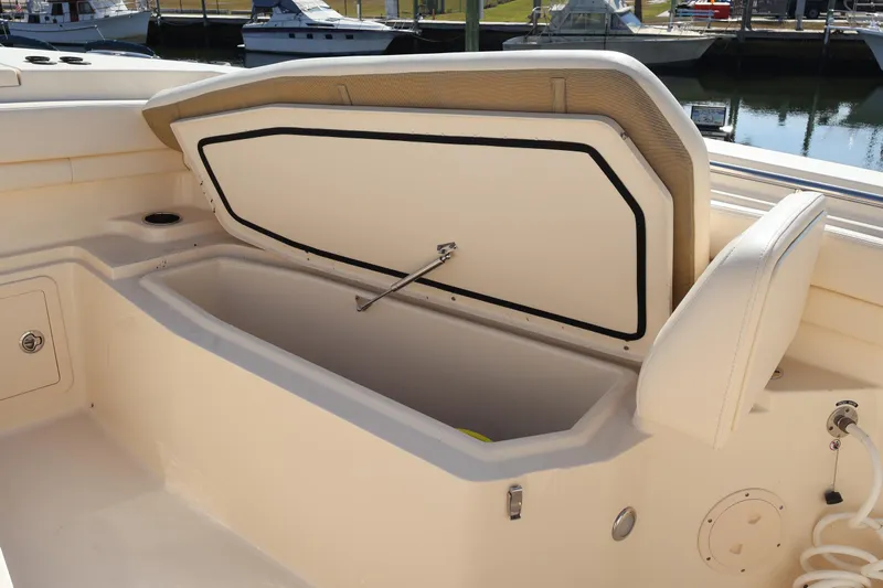  Yacht Photos Pics 2017 Grady-White Canyon 306 boat storage compartment open at marina.