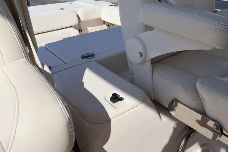 Yacht Photos Pics 2017 Grady-White Canyon 306 boat interior with white leather seating and storage compartments.