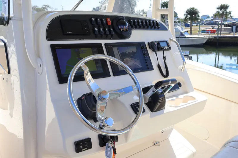  Yacht Photos Pics 2017 Grady-White Canyon 306 boat dashboard with steering wheel and navigation controls.