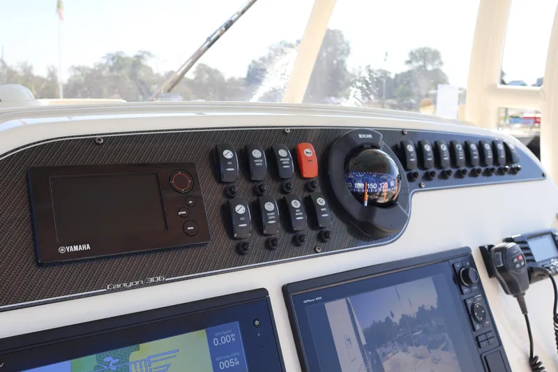  Yacht Photos Pics Control panel of 2017 Grady-White Canyon 306 boat with Yamaha display and compass.