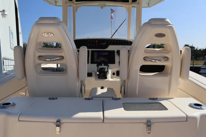  Yacht Photos Pics 2017 Grady-White Canyon 306 boat interior with dual helm seats and control panel.