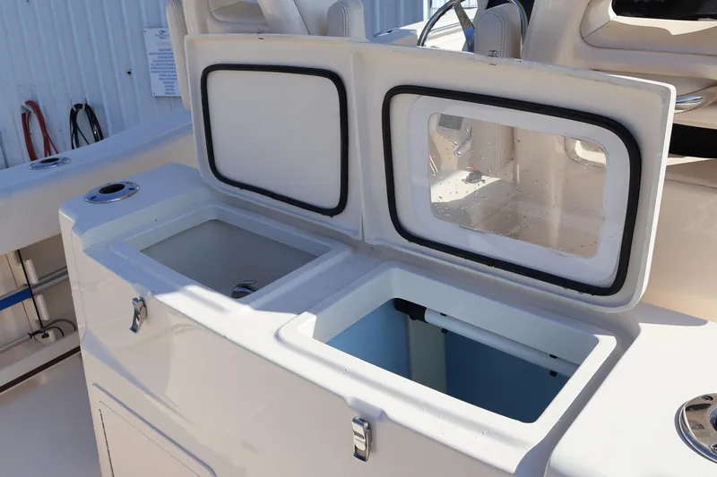  Yacht Photos Pics 2017 Grady-White Canyon 306 boat with open storage compartments.