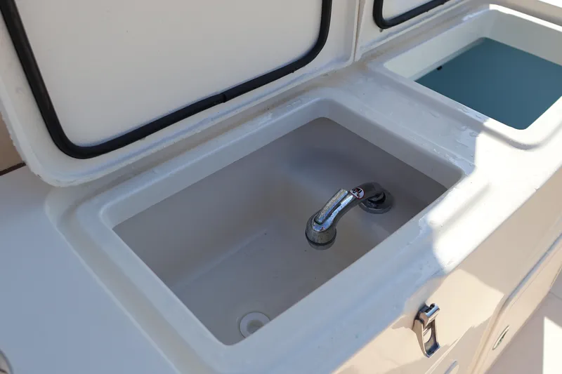  Yacht Photos Pics 2017 Grady-White Canyon 306 boat sink and storage compartments.
