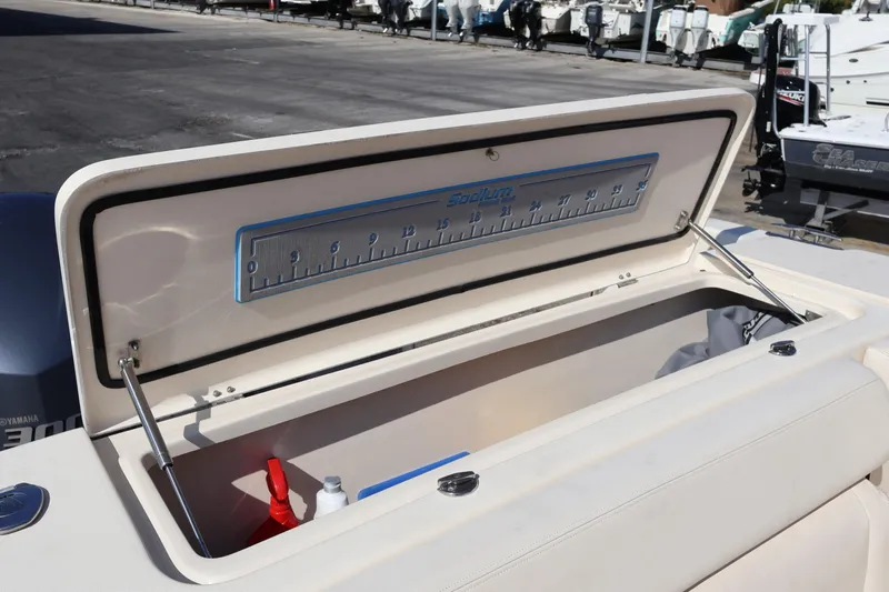  Yacht Photos Pics Open storage compartment on 2017 Grady-White Canyon 306 boat with measuring ruler.