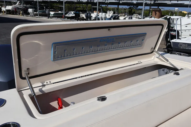  Yacht Photos Pics Open storage compartment on 2017 Grady-White Canyon 306 boat, featuring a built-in ruler.