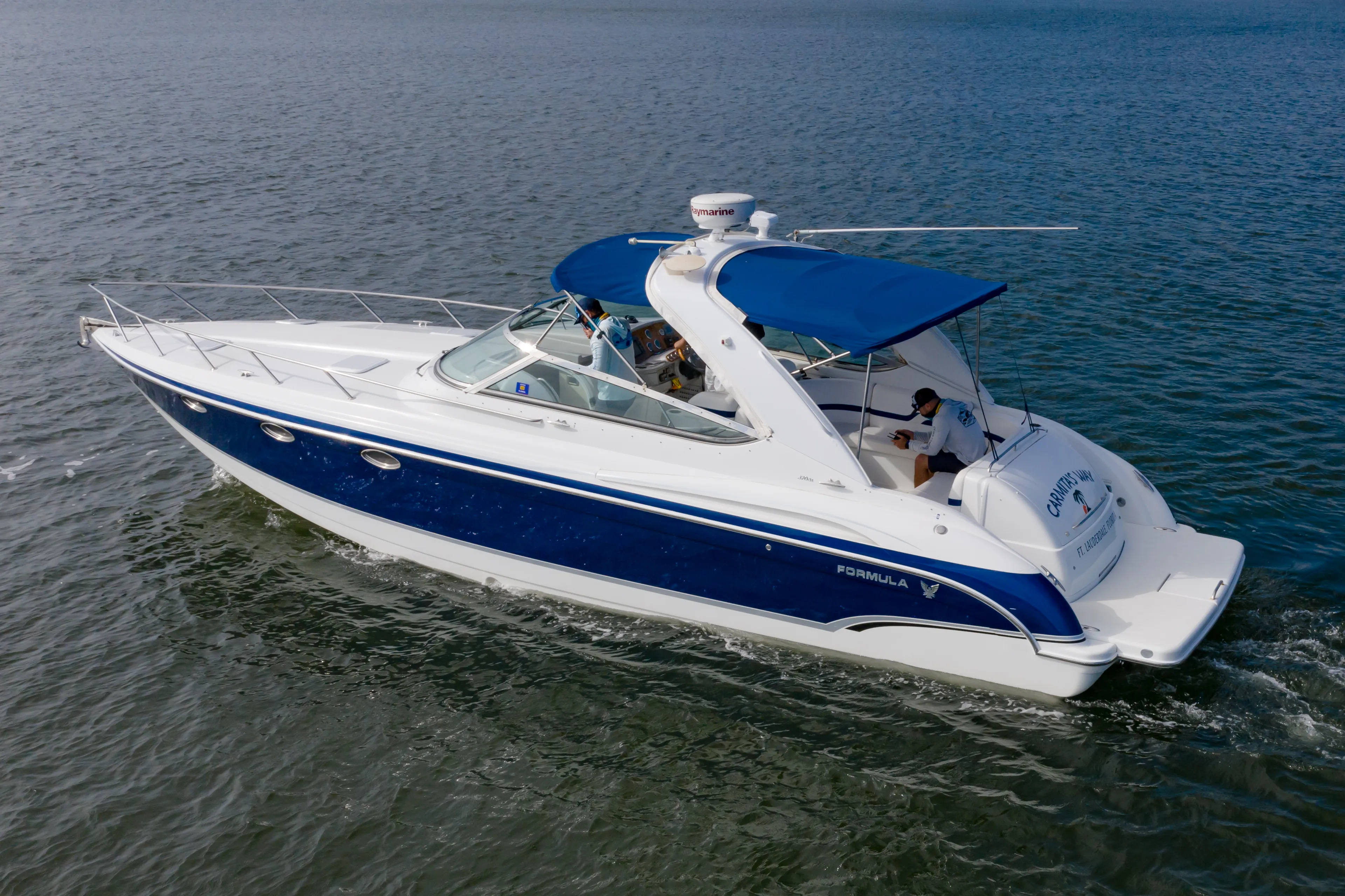 Carmita's Way Yacht Photos Pics 2007 Formula 370 Super Sport boat cruising on open water.