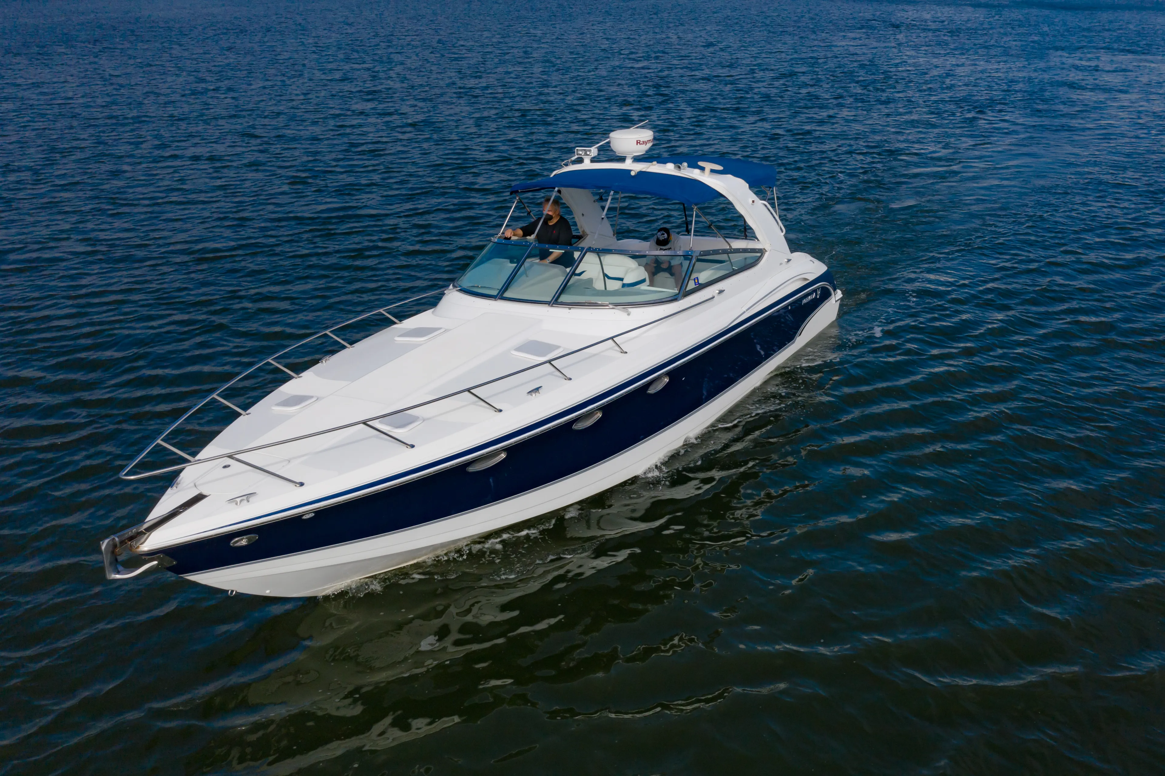 Carmita's Way Yacht Photos Pics 2007 Formula 370 Super Sport boat cruising on open water.