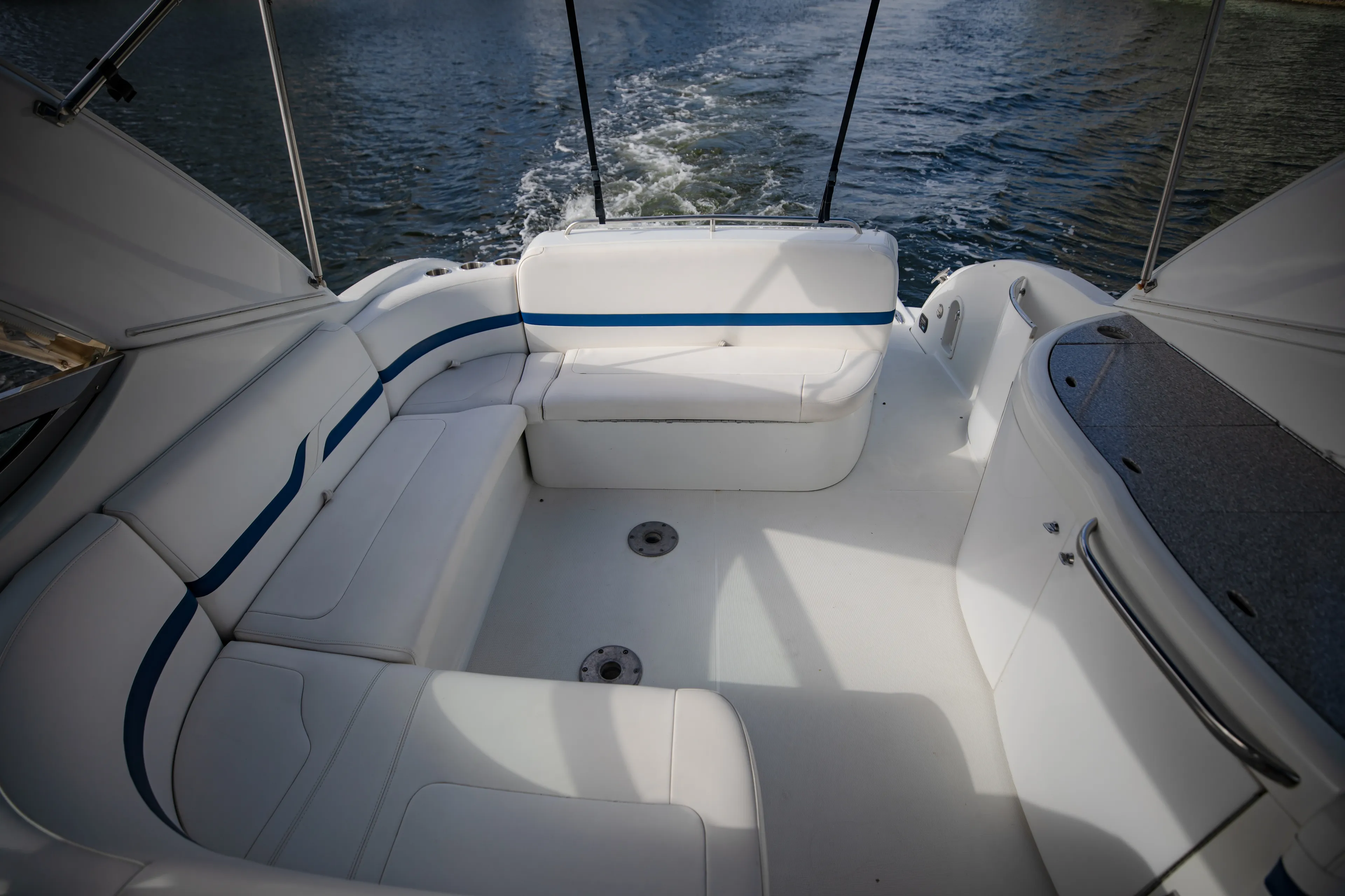 Carmita's Way Yacht Photos Pics 2007 Formula 370 Super Sport boat interior with white seating and blue accents on the water.
