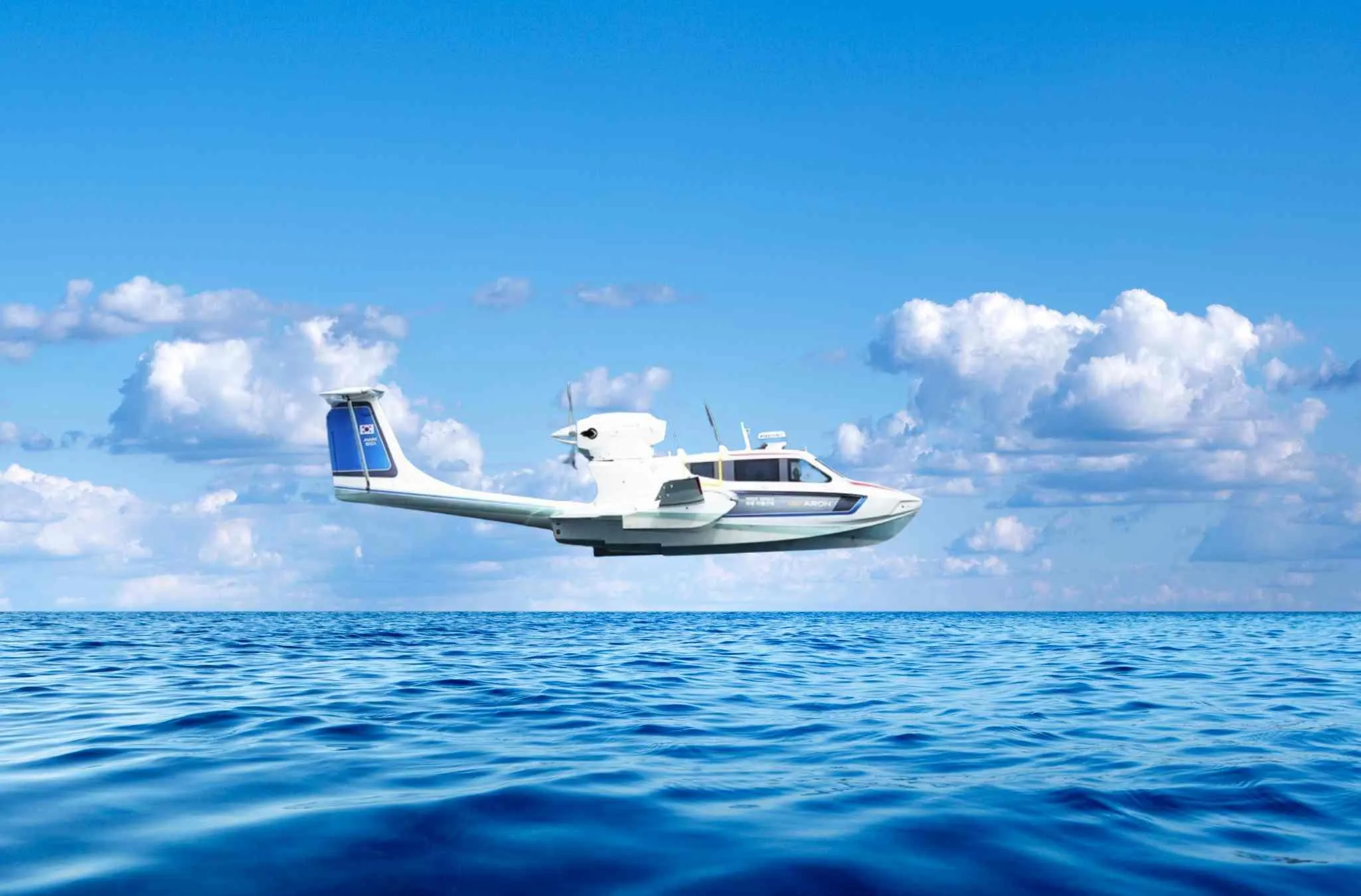 Aron M 80 seaplane flying over ocean, 2025 model, clear blue sky background.
