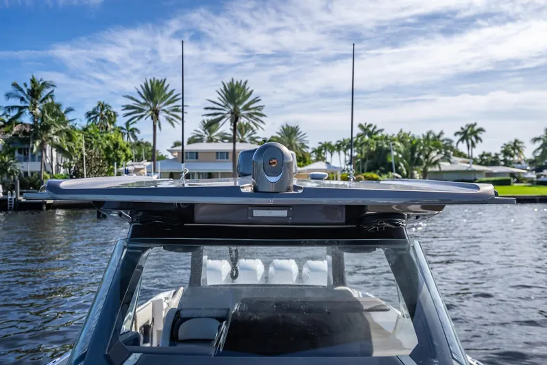 45-18 Yacht Photos Pics 2018 Nor-Tech 450 Sport boat on water with palm trees in background.