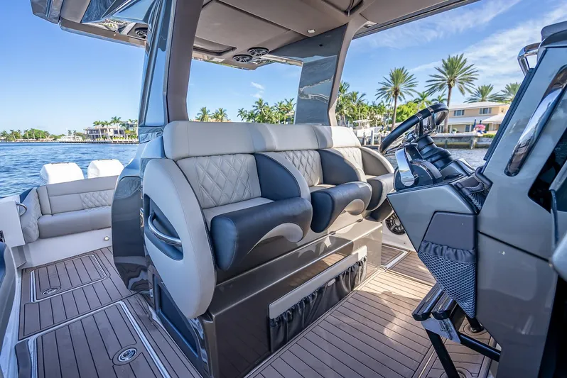 45-18 Yacht Photos Pics 2018 Nor-Tech 450 Sport boat interior with luxurious seating and modern steering console.