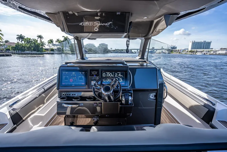 45-18 Yacht Photos Pics 2018 Nor-Tech 450 Sport boat dashboard with digital displays on a sunny day.