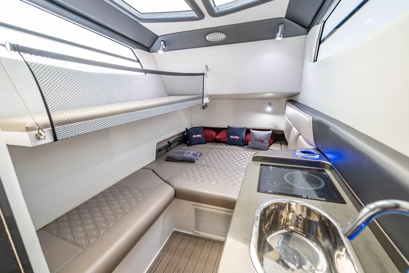 45-18 Yacht Photos Pics Luxurious interior of 2018 Nor-Tech 450 Sport boat with modern amenities and comfortable seating.