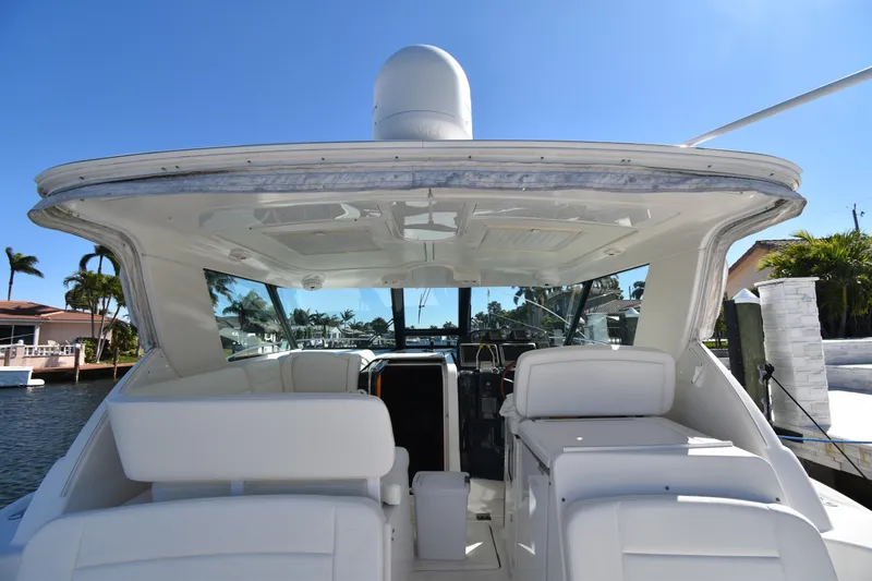 Bossa Nova Yacht Photos Pics 2006 Tiara Yachts 3600 Open, rear view, docked under clear blue sky.