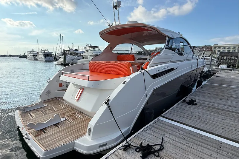  Yacht Photos Pics 2016 Azimut Atlantis 43 yacht docked, featuring sleek design and vibrant orange seating.