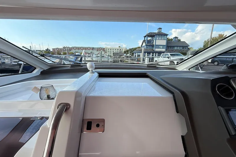  Yacht Photos Pics Interior view of 2016 Azimut Atlantis 43 yacht cockpit with marina background.
