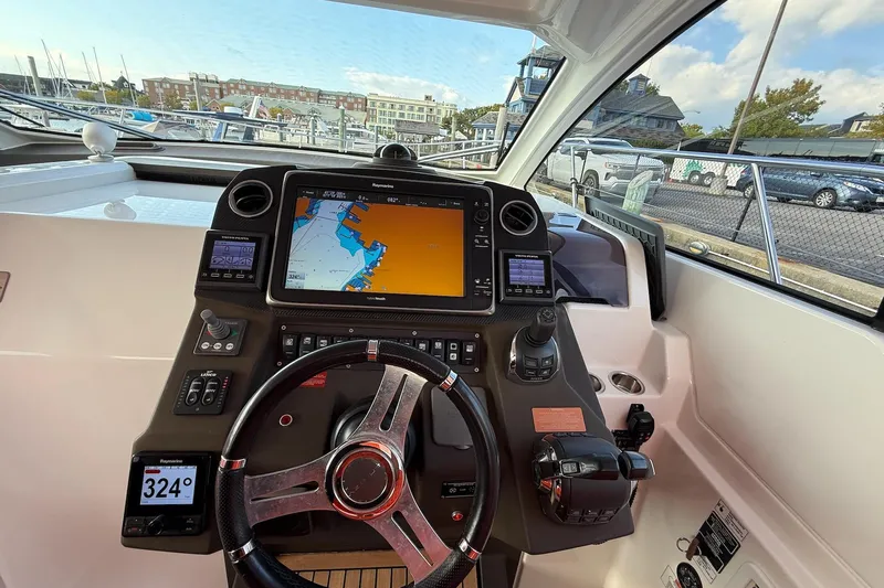  Yacht Photos Pics Helm of 2016 Azimut Atlantis 43 yacht with navigation display and controls.