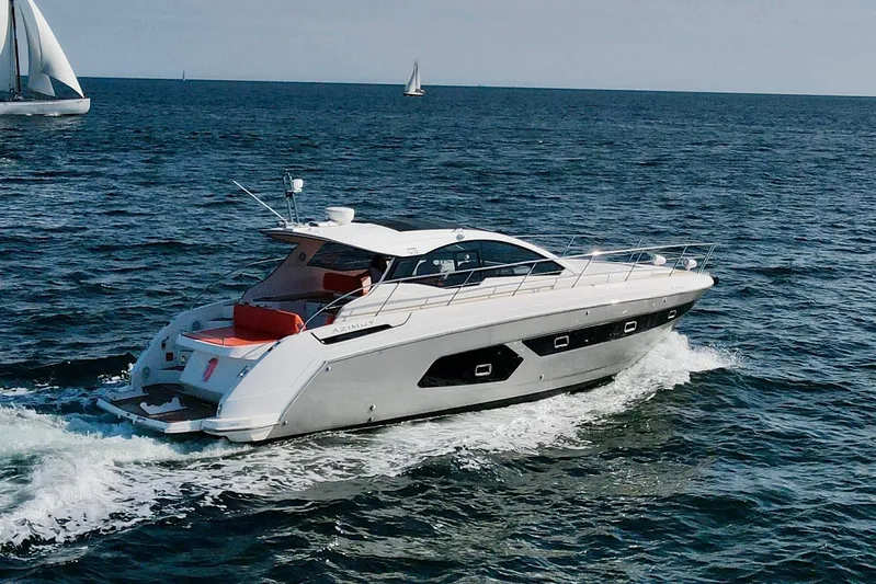  Yacht Photos Pics 2016 Azimut Atlantis 43 yacht cruising on open sea with sailboats in background.