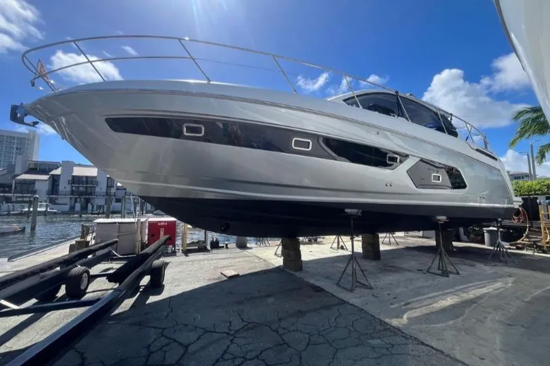  Yacht Photos Pics 2020 Azimut Atlantis 43 yacht on dry dock under clear blue sky.