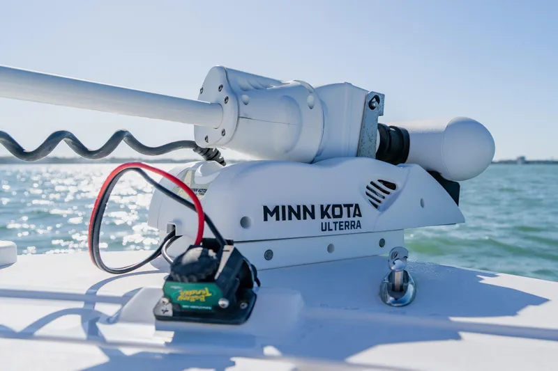  Yacht Photos Pics Minn Kota Ulterra motor on 2022 Caymas 28 HB boat, ocean background.