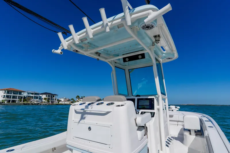  Yacht Photos Pics 2022 Caymas 28 HB boat on water, featuring modern helm and T-top design.