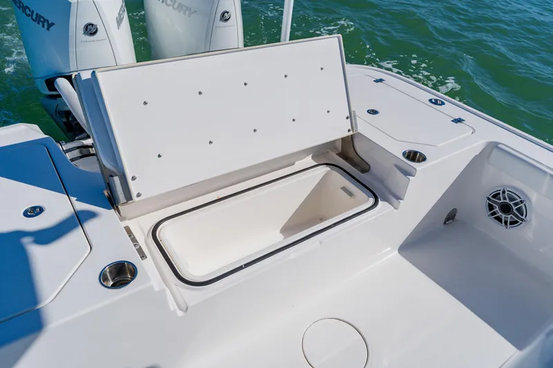  Yacht Photos Pics 2022 Caymas 28 HB boat with open storage compartment and Mercury engines.