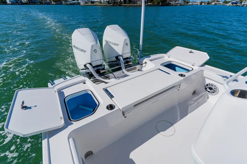  Yacht Photos Pics 2022 Caymas 28 HB boat with dual Mercury engines on open water.