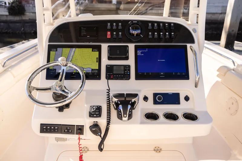 Shooter Yacht Photos Pics 2022 Grady-White 30.6 Canyon boat dashboard with navigation and control systems.