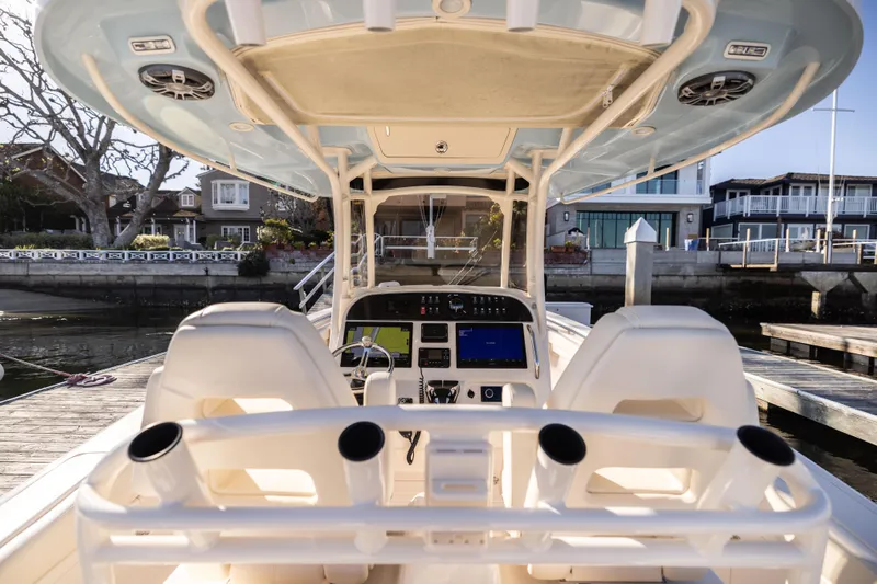 Shooter Yacht Photos Pics 2022 Grady-White 30.6 Canyon boat interior with helm and seating at dock.