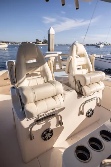 Shooter Yacht Photos Pics 2022 Grady-White 30.6 Canyon boat interior with luxurious seating and cup holders.