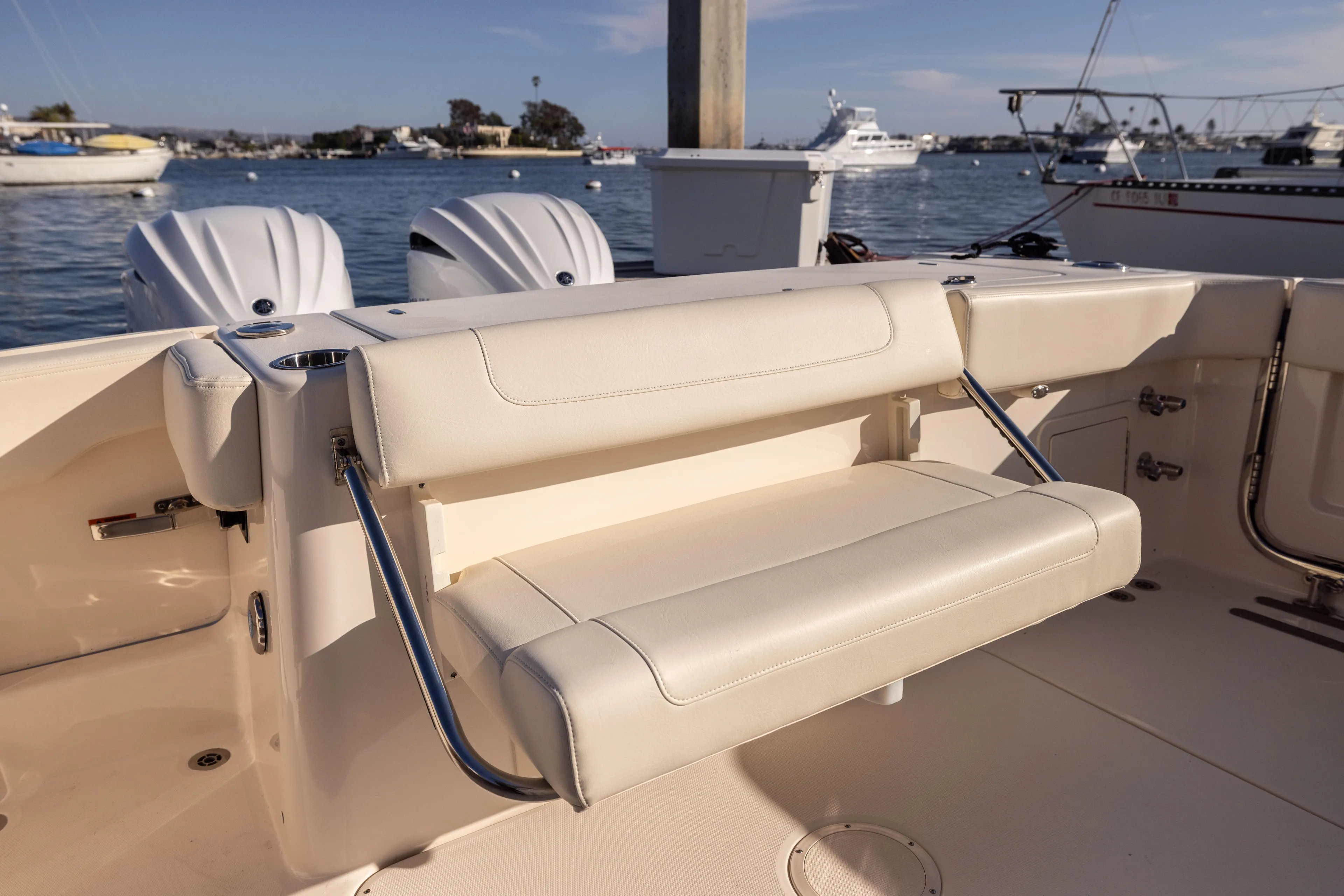 Shooter Yacht Photos Pics 2022 Grady-White 30.6 Canyon boat interior with foldable seating and twin engines.