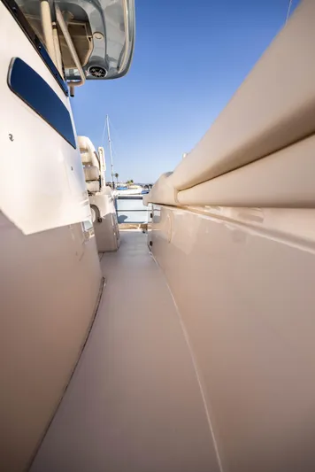 Shooter Yacht Photos Pics 2022 Grady-White 30.6 Canyon boat deck, sleek design, clear blue sky.
