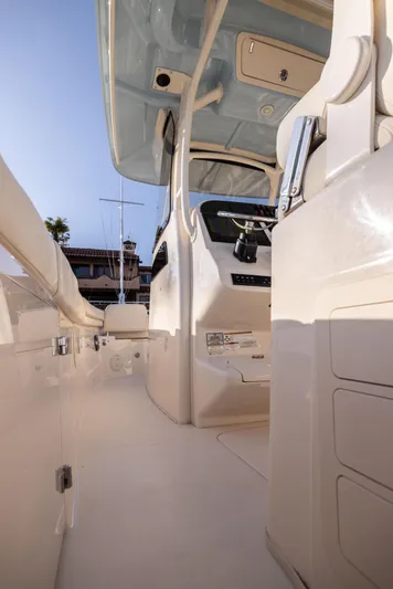Shooter Yacht Photos Pics 2022 Grady-White 30.6 Canyon boat interior with helm and seating area.