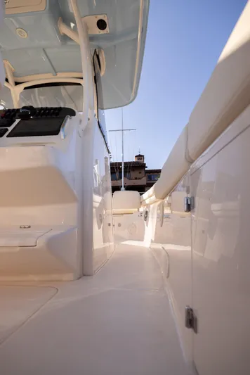 Shooter Yacht Photos Pics 2022 Grady-White 30.6 Canyon boat interior, showcasing sleek design and spacious walkway.