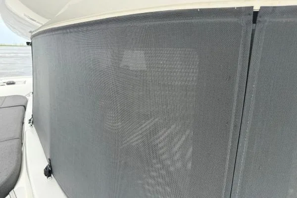 Tomcat Yacht Photos Pics 2023 Lagoon 46 yacht with mesh window cover, offering privacy and sun protection.
