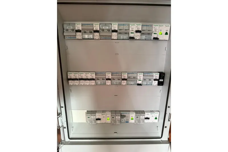 Tomcat Yacht Photos Pics Electrical panel with Schneider Electric circuit breakers on a 2023 Lagoon 46 yacht.