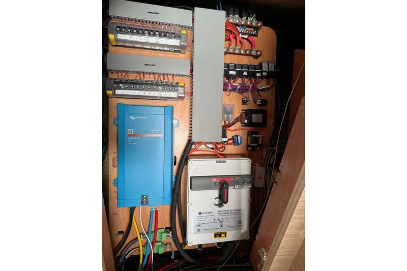 Tomcat Yacht Photos Pics Electrical panel inside 2023 Lagoon 46 yacht, featuring wiring and control systems.