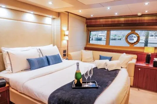 Catch The Wave Yacht Photos Pics Luxurious Sunseeker Manhattan 73 yacht bedroom with elegant decor and champagne, 2013 model.