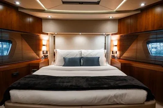Catch The Wave Yacht Photos Pics Luxurious bedroom interior of 2013 Sunseeker Manhattan 73 yacht with elegant wood finishes.