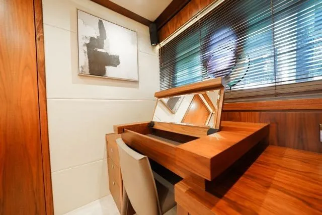 Catch The Wave Yacht Photos Pics Luxurious interior of 2013 Sunseeker Manhattan 73 yacht with elegant wooden vanity.