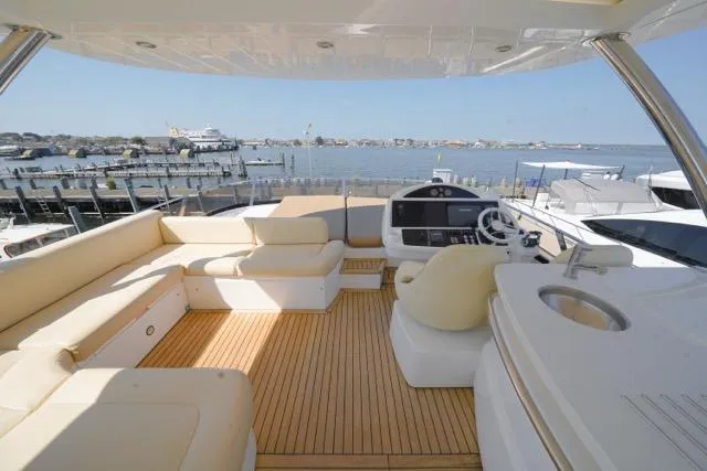 Catch The Wave Yacht Photos Pics Luxurious 2013 Sunseeker Manhattan 73 yacht with spacious deck and elegant seating.