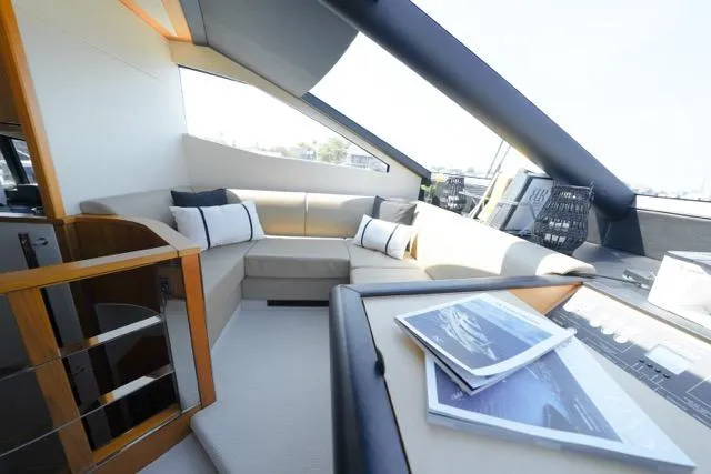 Catch The Wave Yacht Photos Pics Luxurious interior of 2013 Sunseeker Manhattan 73 yacht with modern seating and helm.