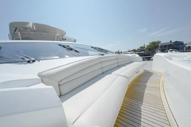 Catch The Wave Yacht Photos Pics Luxurious 2013 Sunseeker Manhattan 73 yacht with sleek white exterior and spacious deck seating.