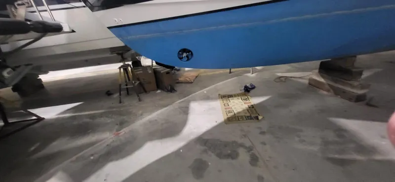  Yacht Photos Pics 2022 Legacy 36 boat hull in a workshop setting, supported by blocks.