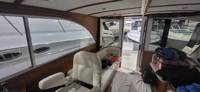  Yacht Photos Pics Interior of 2022 Legacy 36 yacht with seating and view of docked boats.