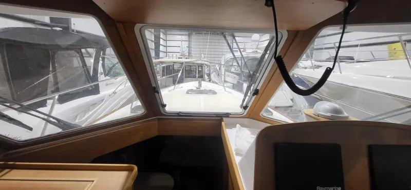  Yacht Photos Pics Interior view of 2022 Legacy 36 Legacy yacht in a marina setting.