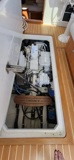  Yacht Photos Pics Engine compartment of 2022 Legacy 36 boat with visible mechanical components.
